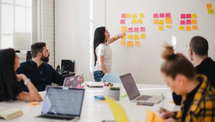 A group of people in a meeting