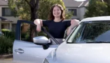 woman getting into car